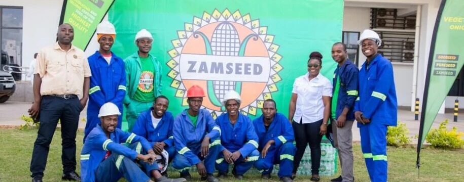 Zamseed staff with the donated cases of drinking water