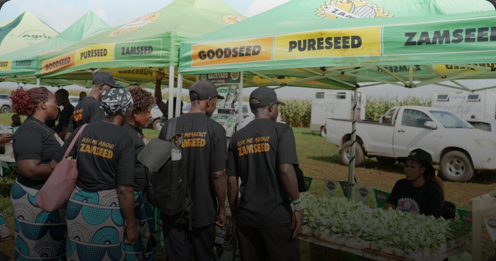 Zamseed staff at a branded Goodseed and Pureseed exhibition stand